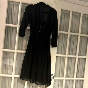 Black dress with small dots and mini gold buttons.